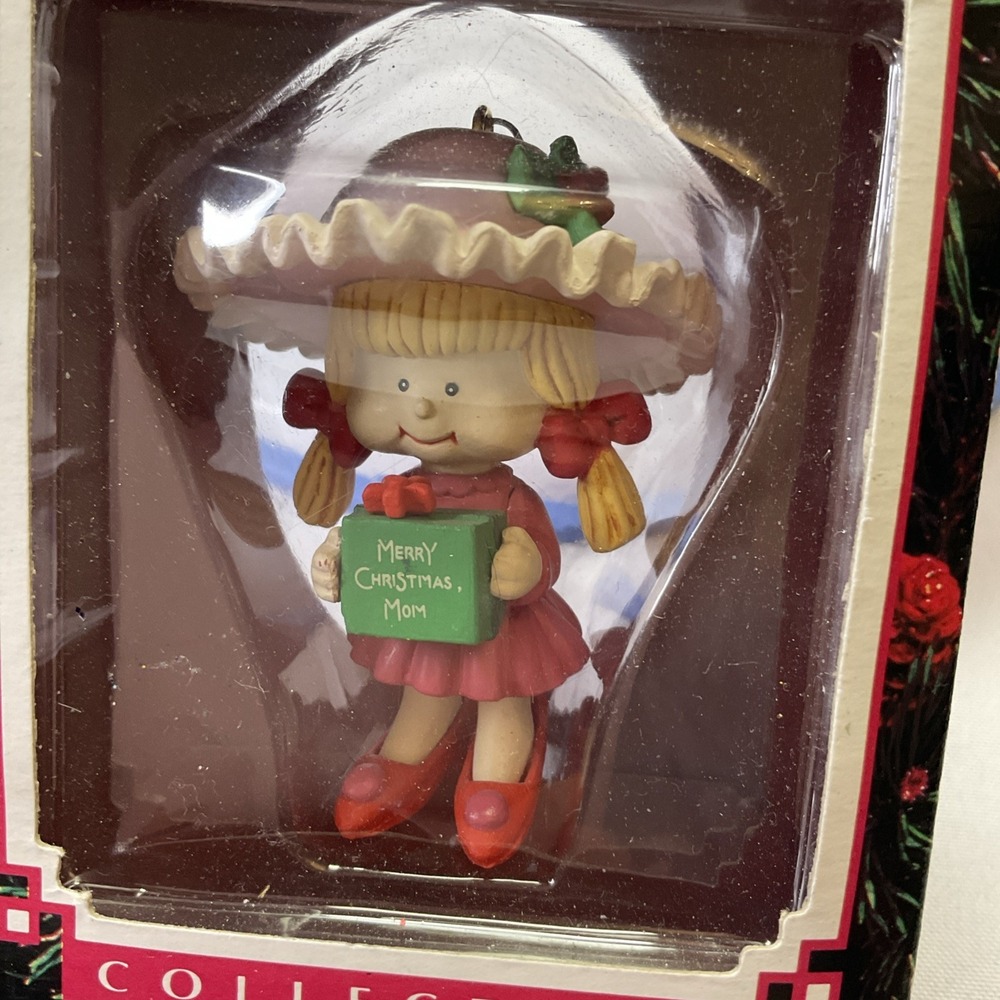 1992 Trim A Tree Ornament‎ Little Girl Holding Merry Christmas Mom Present
